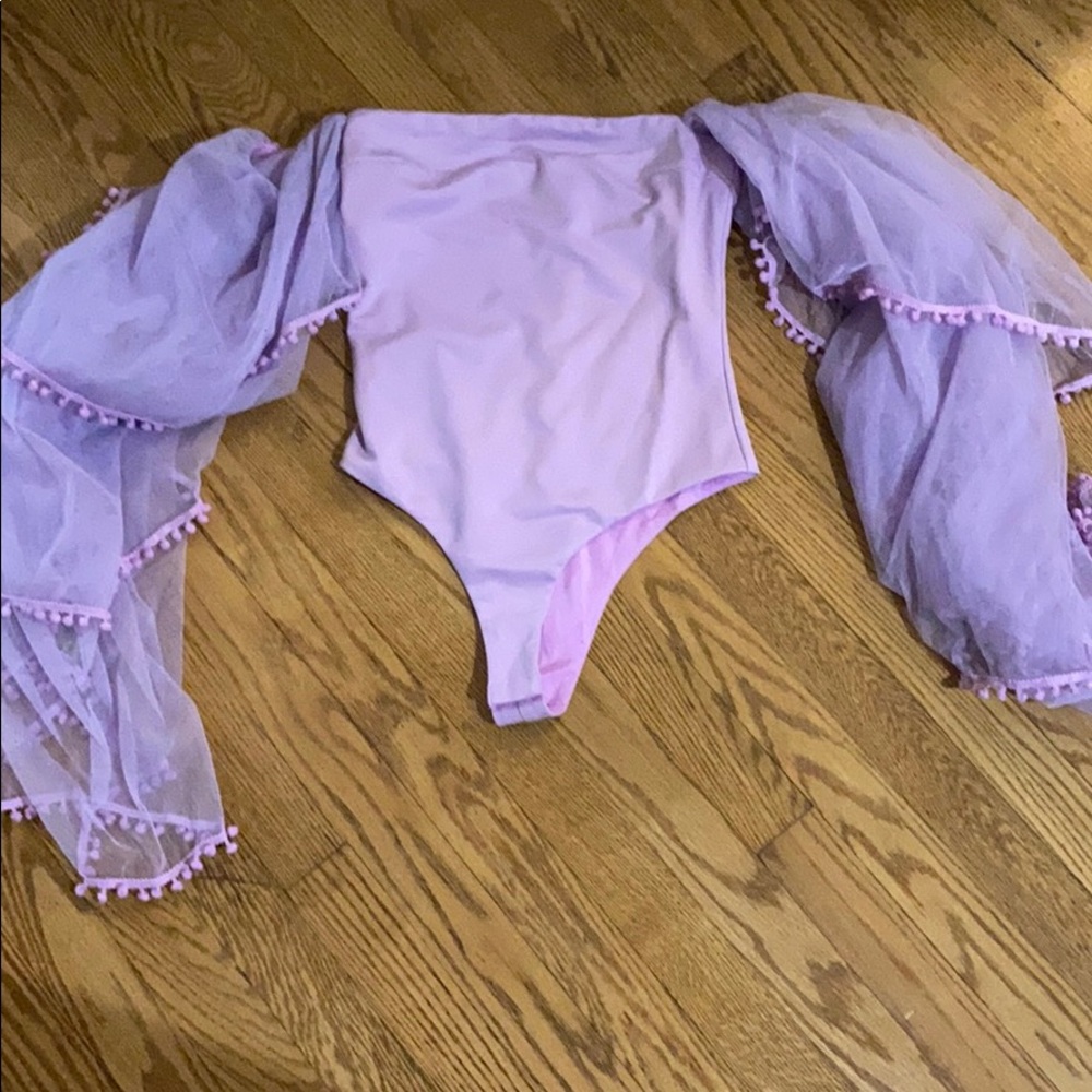 Purple body suit with puffy sleeves